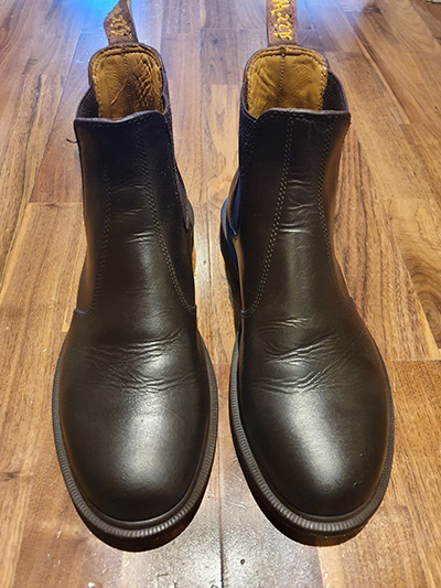 Pair of brown Dr. Marten boots after a shoeshine